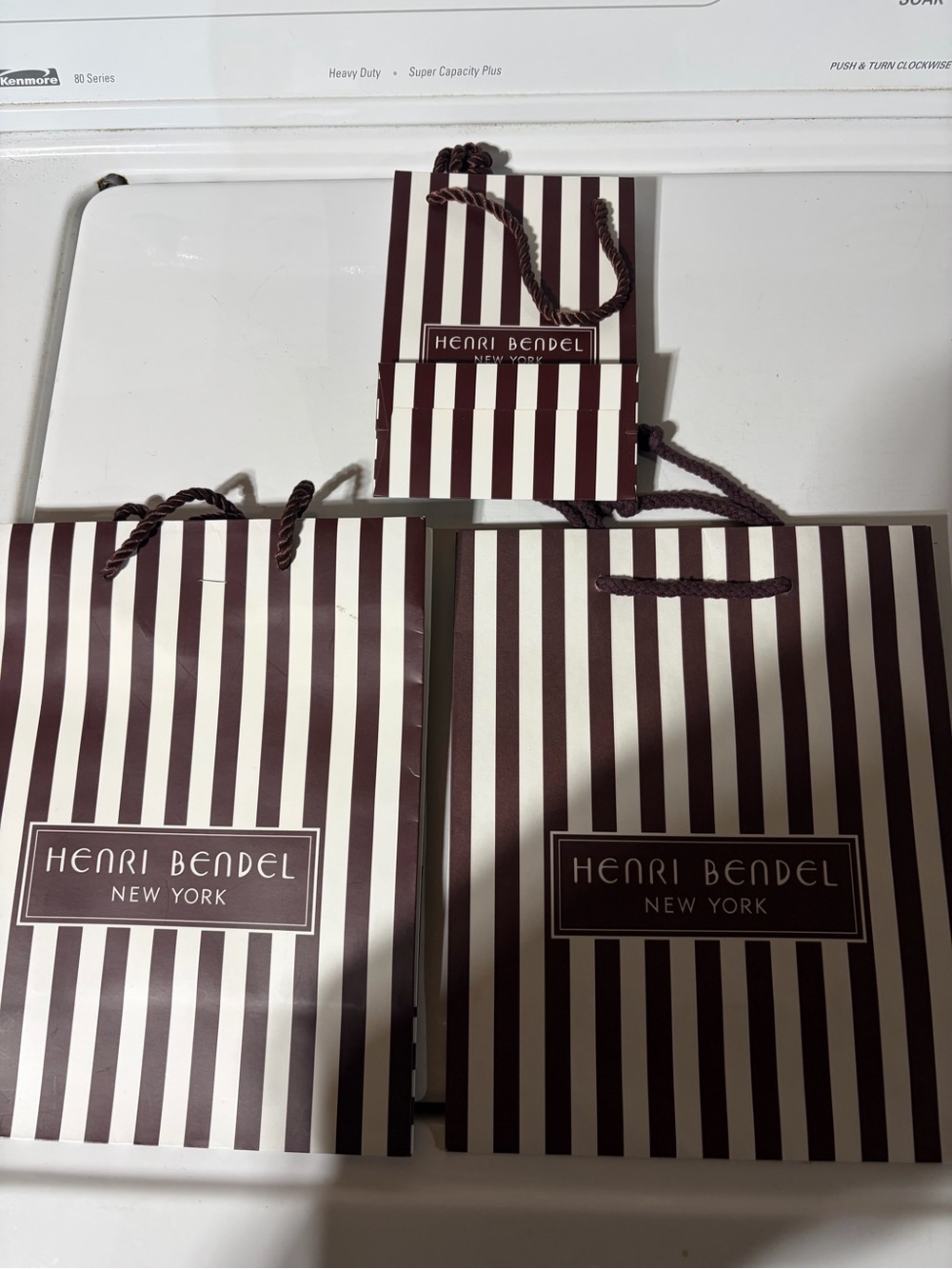 henri bendel Brown and Cream Striped Gift Bags 2 medium, one small
And a dust bg